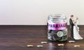 Glass jar full of coins and Marriage is Labelled.