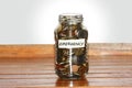 A glass jar full of coins to represents emergency Royalty Free Stock Photo