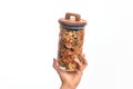 Glass jar full of dry italian vegetables pasta over isolated background Royalty Free Stock Photo