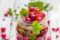 Glass jar full fruits cherries and currants Royalty Free Stock Photo