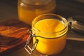 Glass jar with ghee - clarified butter at kitchen Royalty Free Stock Photo