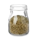 Glass jar of hemp seeds on white Royalty Free Stock Photo