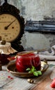 Glass jar with homemade canned strawberry jam, marmalade, jelly on rustic wooden grey table with basil Royalty Free Stock Photo