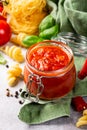 Glass jar with homemade classic spicy tomato pasta or pizza sauce. Royalty Free Stock Photo