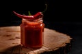 Glass jar with homemade classic spicy tomato pasta or pizza sauce with spices and herbs Royalty Free Stock Photo