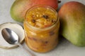 Glass jar with homemade mango chutney and fresh mango Royalty Free Stock Photo