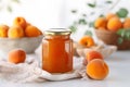 Glass jar with homemade marmalade or jam with fresh apricot fruits