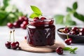 Glass jar with homemade marmalade or jam with fresh cherry fruits