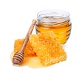 Glass jar with honey, honeycomb and honey dipper isolated on white background Royalty Free Stock Photo