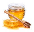 Jar with honey, honeycomb and wooden honey dipper isolated on white background Royalty Free Stock Photo