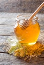 Glass jar of honey, Linden flowers on wooden background Royalty Free Stock Photo