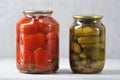 Glass jar with an iron lid with canned red tomatoes and cucumbers Royalty Free Stock Photo