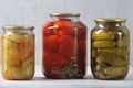 Glass jar with an iron lid with canned red tomatoes and cucumbers Royalty Free Stock Photo