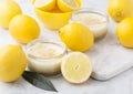 Glass jar with lemon cheesecake with fresh lemons Royalty Free Stock Photo