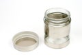 Glass jar in metal over white background Royalty Free Stock Photo