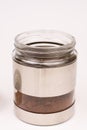 Glass jar in metal over white background Royalty Free Stock Photo