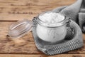 Glass jar of natural starch on wooden table, closeup Royalty Free Stock Photo