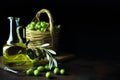 Glass jar of olive oil on wooden cutting board and a wicker basket with fresh green olives on black background. Copy space on Royalty Free Stock Photo