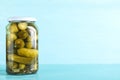 Glass jar of pickles on wooden table. Space for text Royalty Free Stock Photo