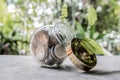 Glass jar piggy bank with coins. Plan your savings, run a growing business for success and save for retirement Royalty Free Stock Photo