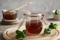 A glass jar of Plectranthus amboinicus syrup for common cold