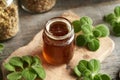 A glass jar of Plectranthus amboinicus syrup for common cold