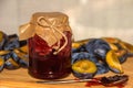 Glass jar with plum jam homemade and fresh plums Royalty Free Stock Photo