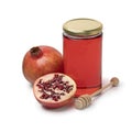 Glass jar with pomegranate honey and fresh pomegranate fruit on white background