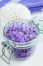 Glass jar with purple bath salts foot soak wirh dry lavender flowers. Close up, copy space Royalty Free Stock Photo