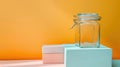 Glass Jar and Rectangular Box on Pastel Surface Royalty Free Stock Photo