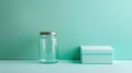 Glass Jar and Rectangular Box on Pastel Surface Royalty Free Stock Photo