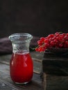 Glass jar of red currant soda drink on a dark wooden table. Summer healthy detox lemonade, cocktail or another drink Royalty Free Stock Photo