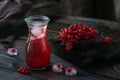 Glass jar of red currant soda drink on dark wooden table. Summer healthy detox lemonade, cocktail or another drink background. Low Royalty Free Stock Photo