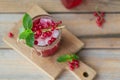 Glass jar of red currant soda drink on a wooden table. Summer healthy detox lemonade, cocktail or another drink Royalty Free Stock Photo