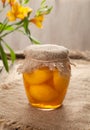 Glass jar with ripe peach compote natural vegetarian dessert food