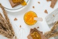 In glass jar, rye crisp bread Swedish crackers with spread orange jam Royalty Free Stock Photo