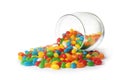 Glass jar and scattered bright jelly beans on white Royalty Free Stock Photo
