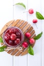 Glass jar of small paradise apple jam with fresh fruits on white table. Royalty Free Stock Photo