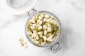 Glass jar with sprouted green mung beans on white marble table, top view Royalty Free Stock Photo