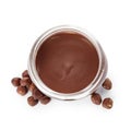 Glass jar with tasty chocolate cream and hazelnuts isolated on white Royalty Free Stock Photo