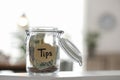 Glass jar with tips on table indoors Royalty Free Stock Photo