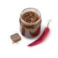 Glass jar with a variation of sambal, chili sauce, with shrimp paste on white background