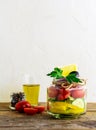 A glass jar with vegetable salad and ingredients. Healthy food, diet, detox concept Royalty Free Stock Photo