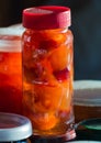 Glass jars with apple jam close-up. Home canning. Delicious dessert for tea. Cooking. Vertical photo Royalty Free Stock Photo