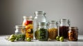 Glass jars for canning of different sizes on a white background.