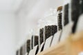 Glass jars of coffee beans stand on the shelf of the store. Royalty Free Stock Photo