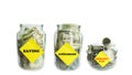 Glass Jars with coins and bills. Royalty Free Stock Photo
