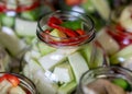 Glass jars with different colors, types, shapes of vegetables, vegetables prepared for home canning, autumn harvest time Royalty Free Stock Photo