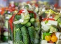 Glass jars with different colors, types, shapes of vegetables, vegetables prepared for home canning, autumn harvest time Royalty Free Stock Photo