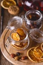 Glass Jars of Dried Citrus and Berry for Tea Ingredients for Tasty Hot Beverage Wooden Tray Wooden Background Dried Oranges Royalty Free Stock Photo